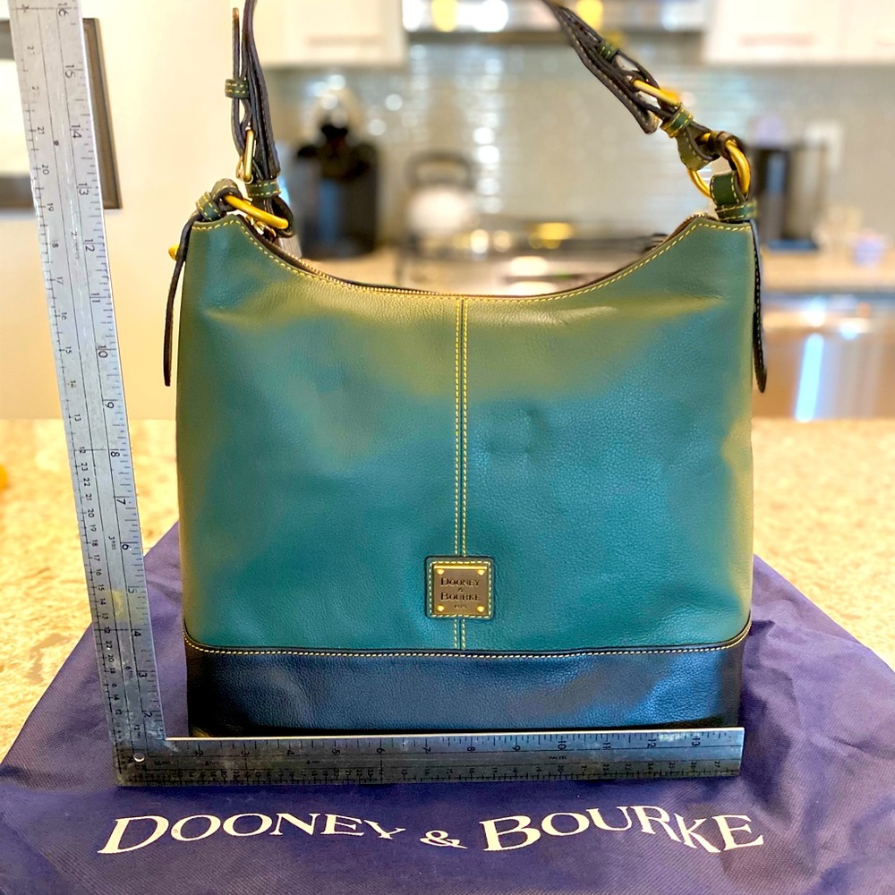 Brand new Dooney and Bourke Green and Navy shoulder bag, never worn.